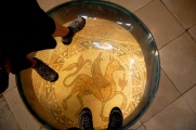 A somptuous mosaic of a gryphon decorating the floor of a previous cathedral (11C).