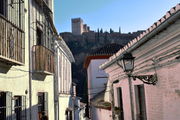 A view of the Alhambra from the streets of the old Moorish medieval quarters: the Albaicín.